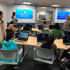 Image of coding workshop attendees in digital lab