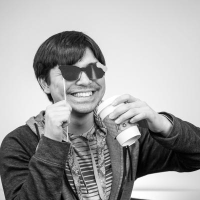 Photo of Joah with sunglasses and coffee cup