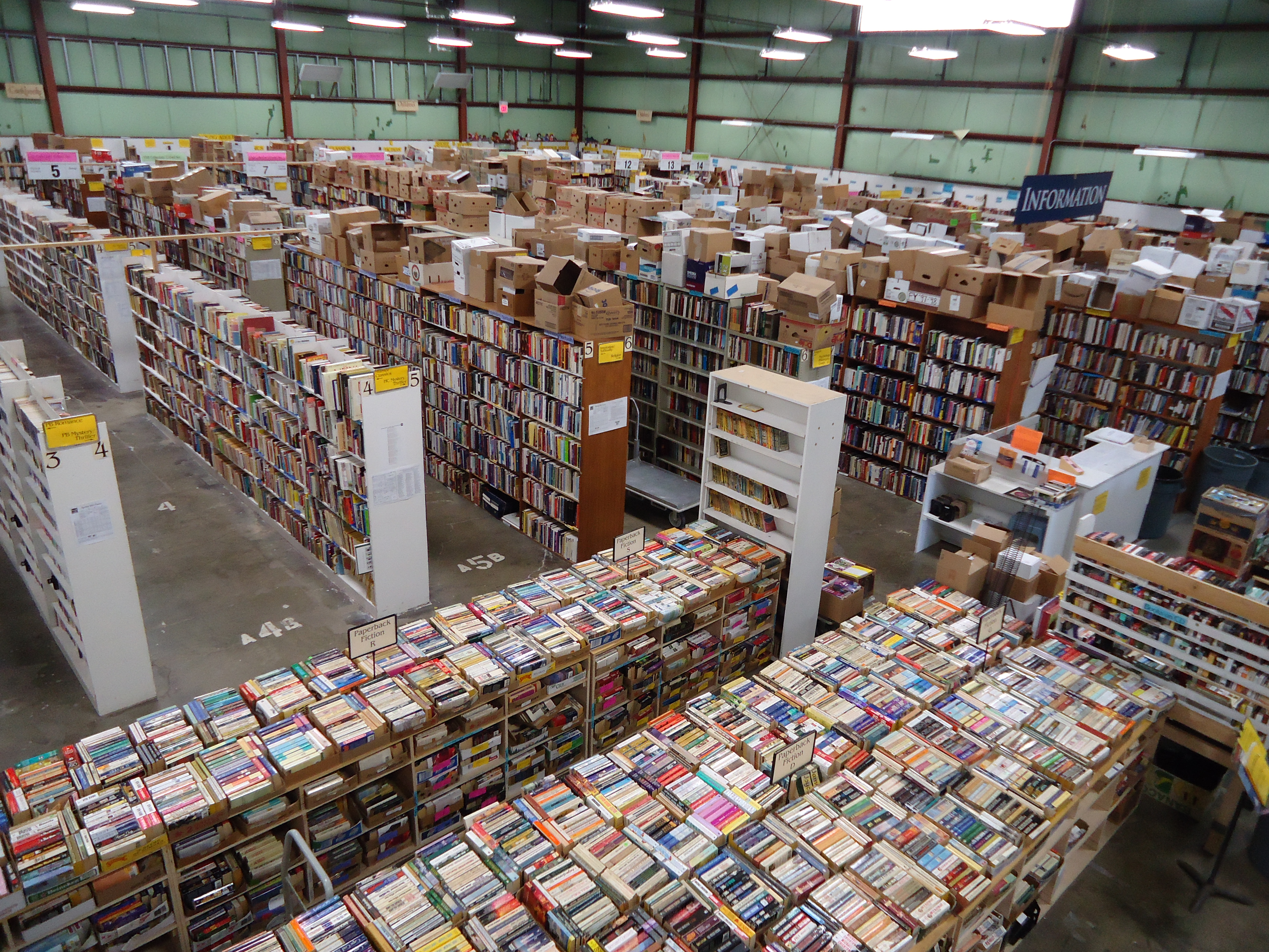 An image showing the 250,000 books, dvd, cds and other material inside the Friends of the Tompkins County Public Library's warehouse used for its annual book sale
