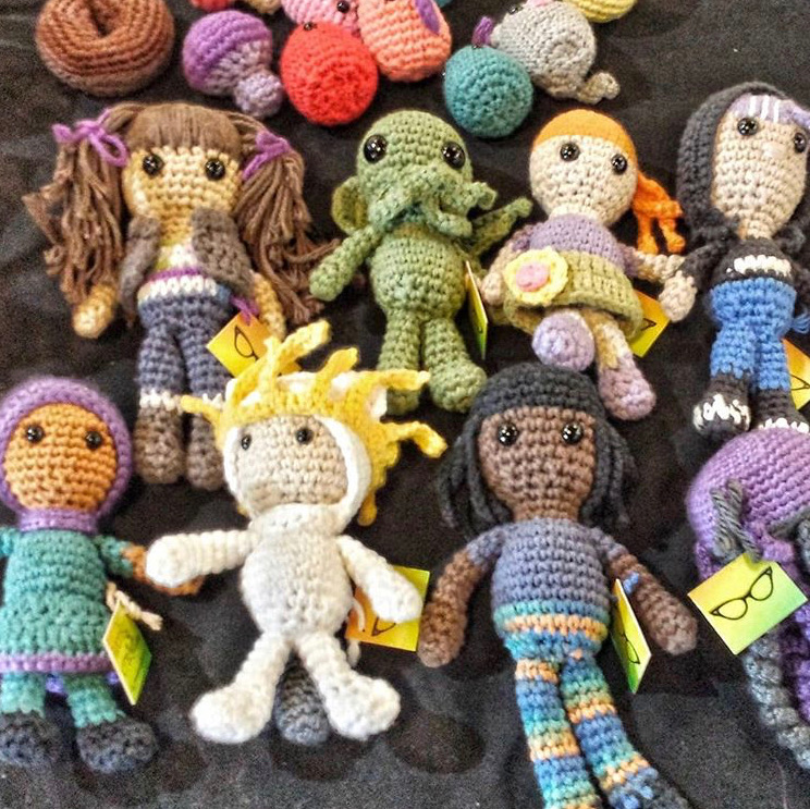 A gathering of many crocheted characters and people
