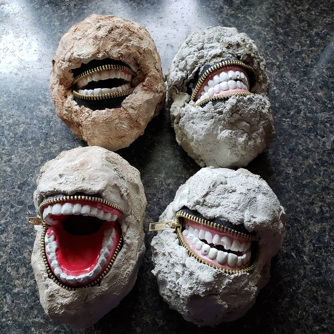 concrete rocks with teeth in them