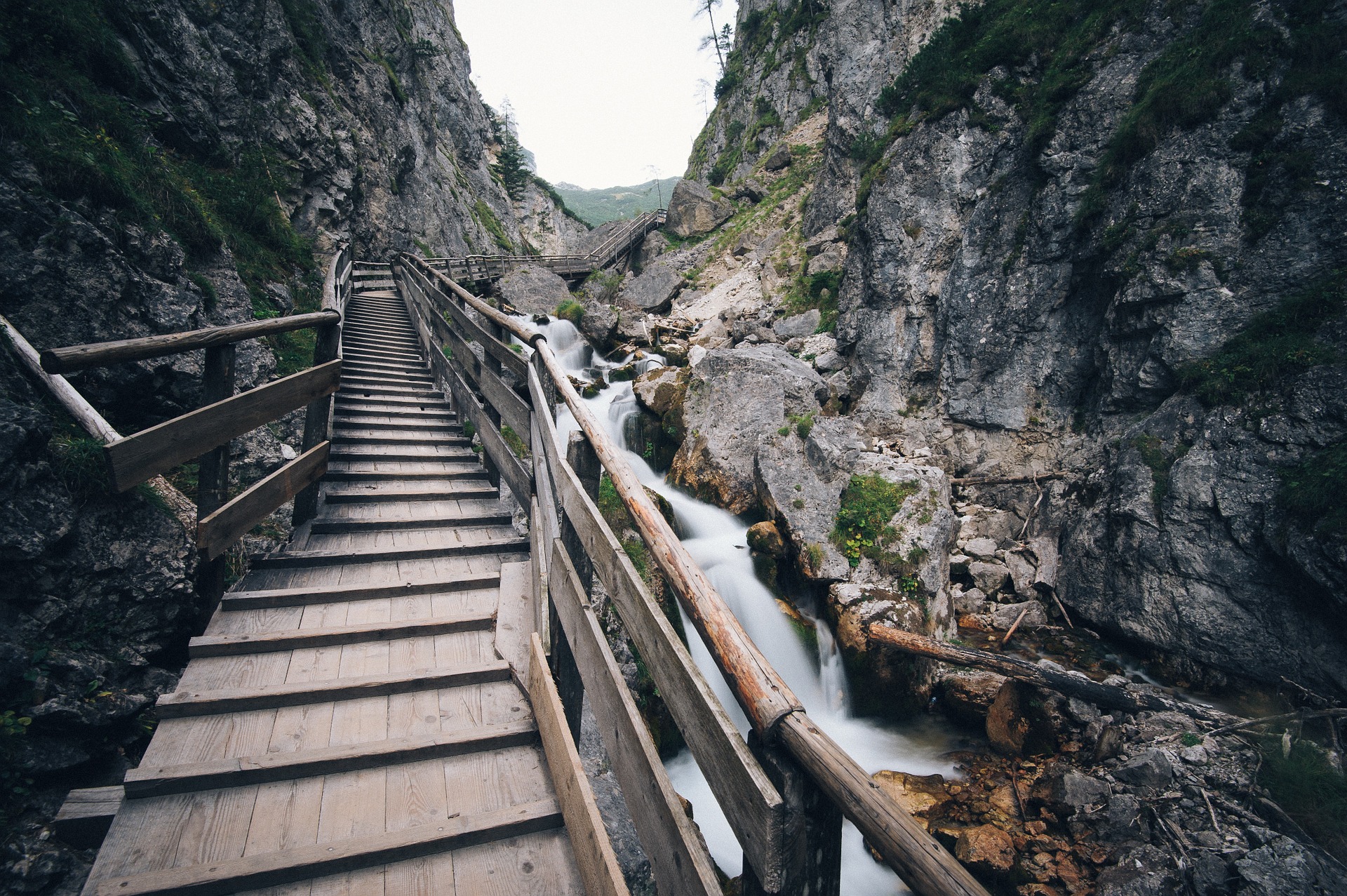 Wooden stairway through rocky cliffs