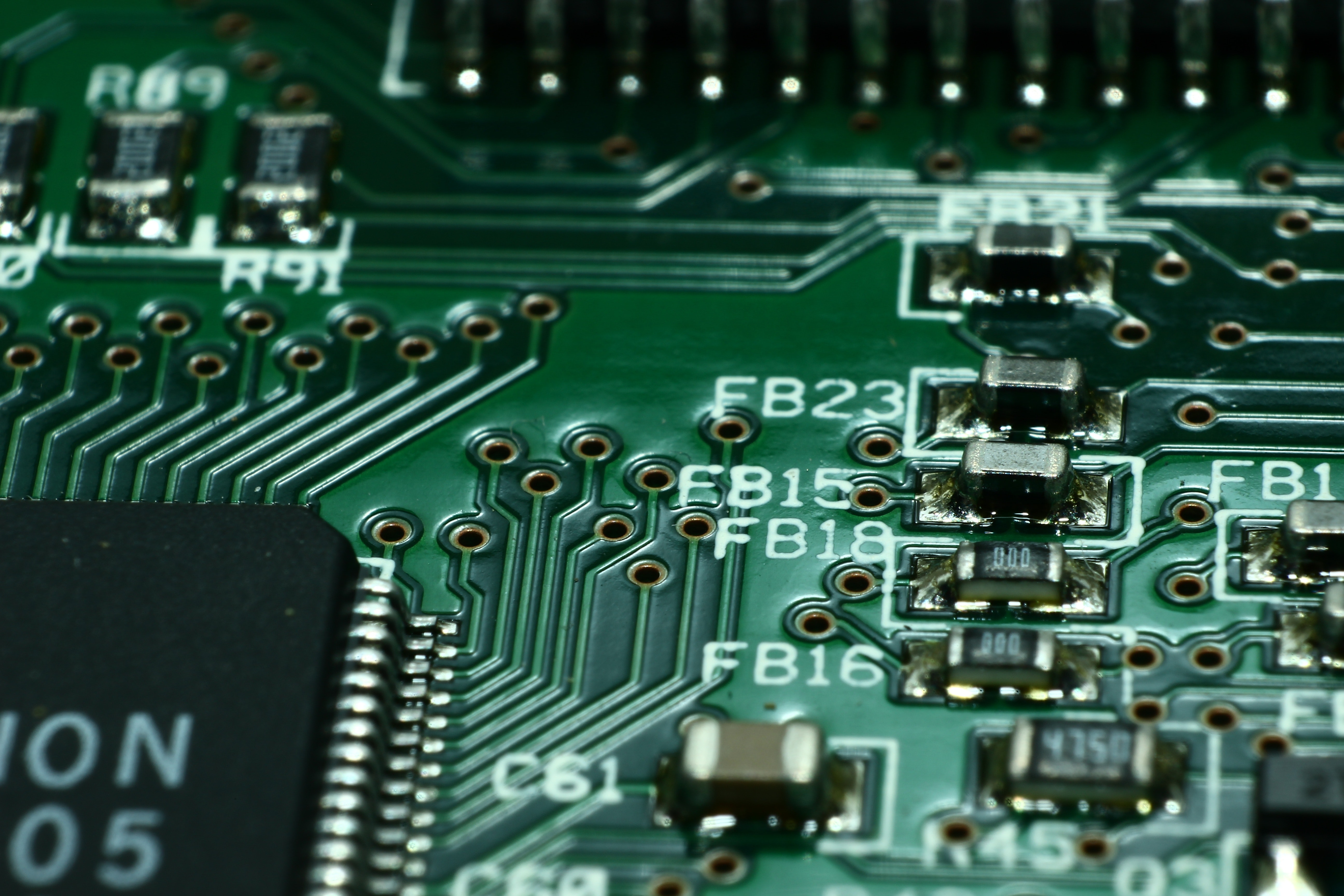 A close-up of a green computer circuit board