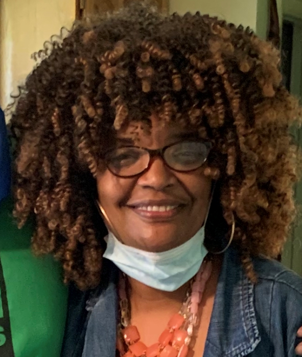 Image of artist Sherri Porter, smiling at the camera