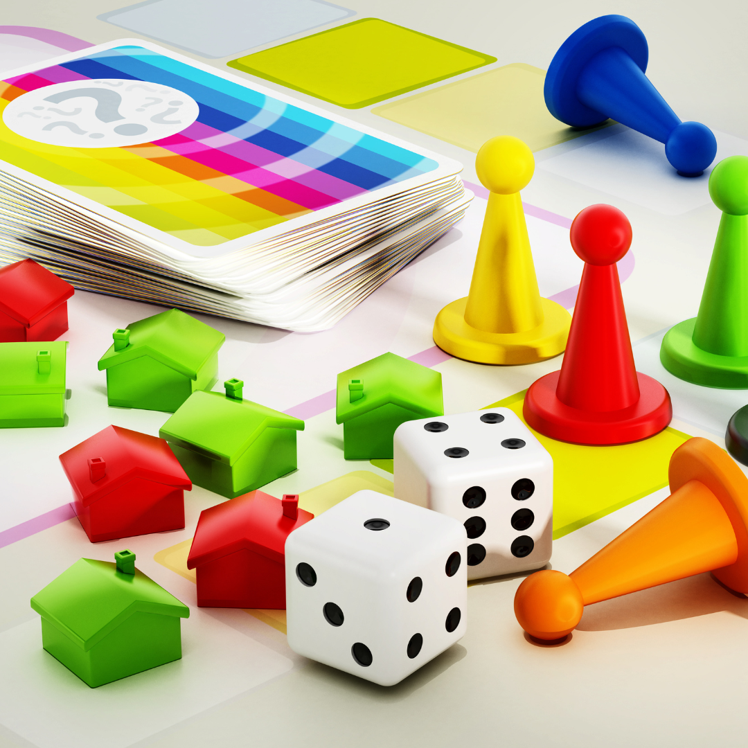 Image of board game pieces, playing cards, and dice