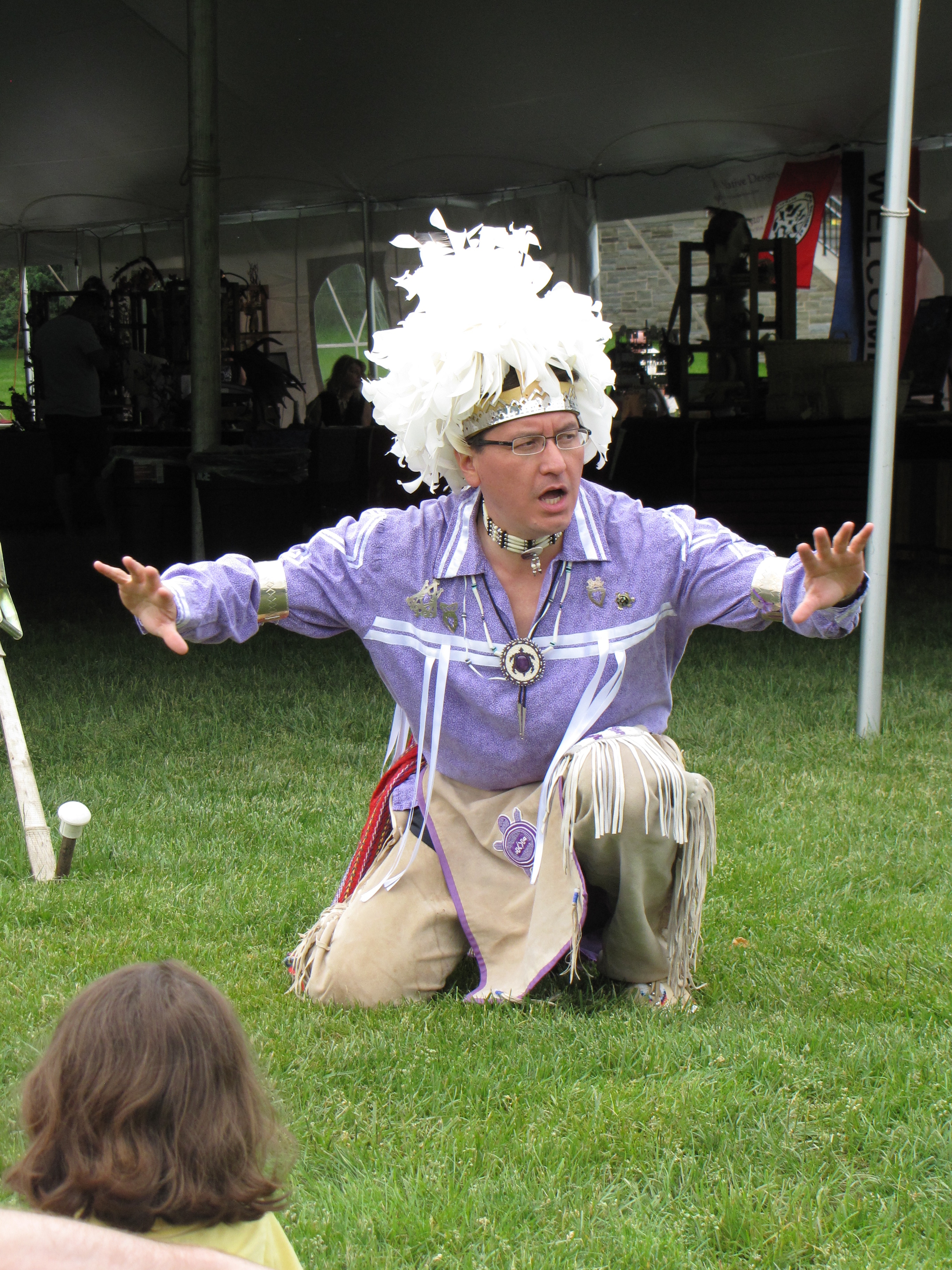 Photograph of Storyteller Perry Ground in a field of grass