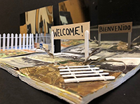 Image depicting a portion of the Draw a Line exhibit, showing a welcome sign and fences Image depicting a portion of the Draw a Line exhibit, showing a welcome sign and fences