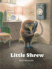the cover of the book Little Shrew. It shows an illustration of a shrew, holding an old-style telephone up to its ear.