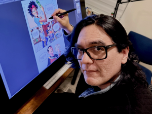 A picture of Pedro X Molina drawing a political cartoon