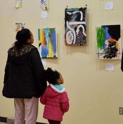 Mother and Daughter viewing art exhibit
