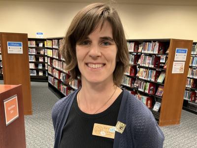 A picture of Kat Savage in the Youth Services Section of TCPL