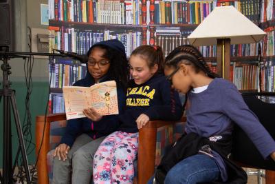 Girls reading together during READATHON
