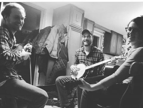 Photo of the Flywheels band members with instruments