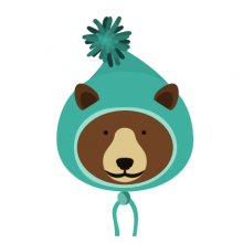 brown bear wearing green winter hat with pom pom