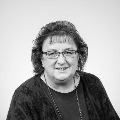 Photo of Nancy smiling at camera